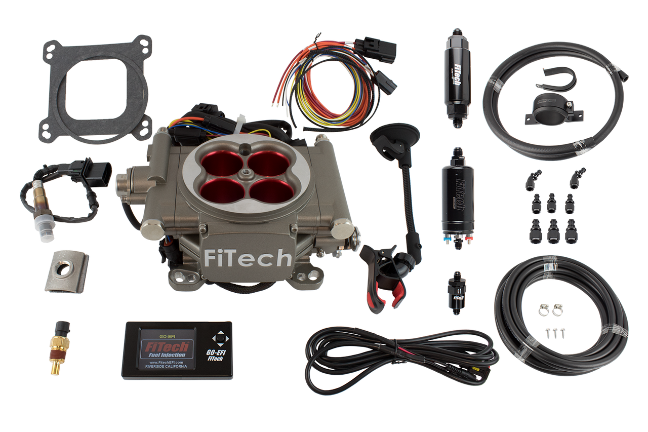 An image of the FiTech Go Street EFI 400 HP System Master Kit components laid out on a white background, including a grey throttle body, various sensors, fuel lines, fittings, and electronic modules.