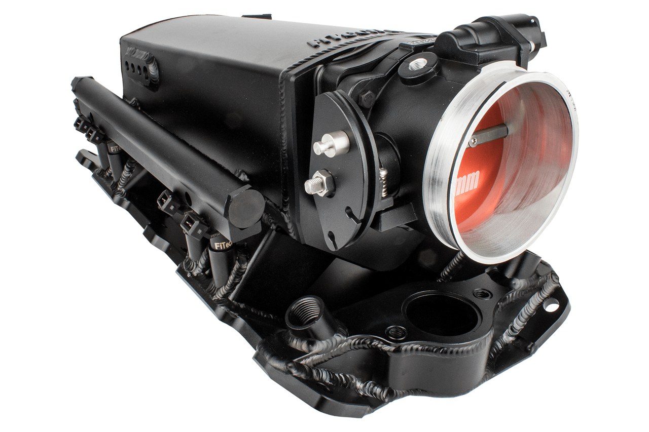 A black FiTech Ultra Ram Small Block Chevy EFI fuel injection system component, focusing on an intake manifold for a small block Chevy engine.
